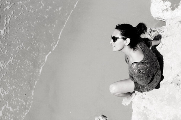 Woman sitting on the beach