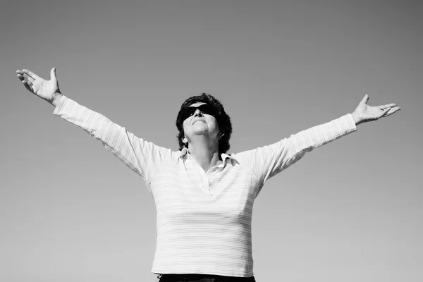 Happy senior woman with open arms — Stock Photo, Image