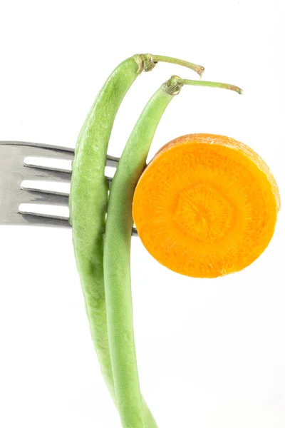 Carottes et haricots verts sur une fourchette Images De Stock Libres De Droits