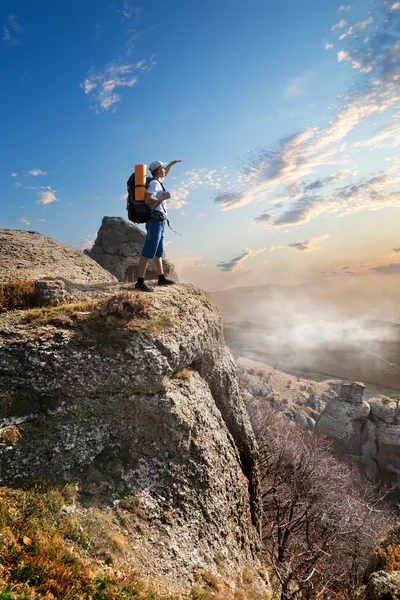 Tourist on rock — 스톡 사진