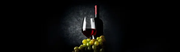 Composition with wine on black — Stock Photo, Image