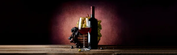 Wine with grape in basket — Stock Photo, Image