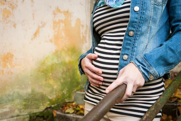 Pregnant woman touching her belly — Stock Photo, Image