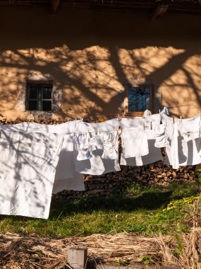 Clothes line full of laundry  clipart