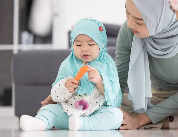 Muslim Mom Hijab Her Little Daughter Sitting Living Room Loving — Stock Photo, Image