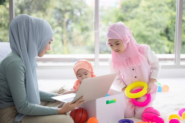 Muslim Mother Working Laptop Cute Little Baby Playing Toys Living — Stock Photo, Image