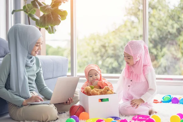 Muslim Mother Working Laptop Cute Little Baby Playing Toys Living — Stock Photo, Image