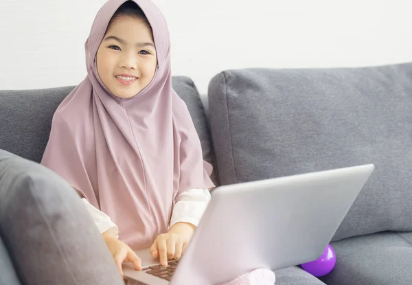 Asian Muslim Teenager Surfing Internet Wiht Notebook Sofa Living Room — Stock Photo, Image