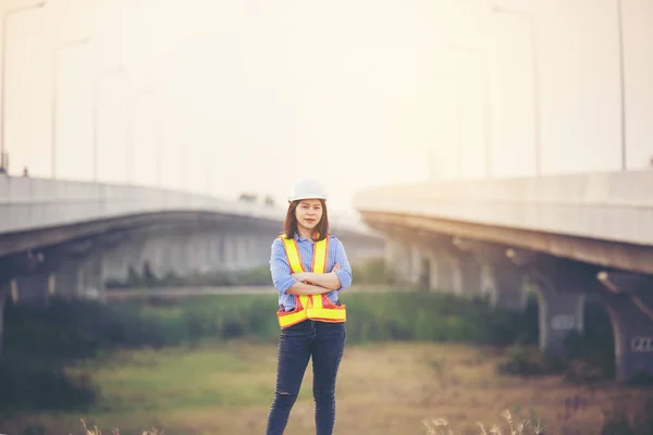 Female engineer with helmet showing thumb up as ok sign at construction site. Power of women, Gender equality, Working women, Confident Female Engineer