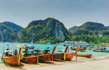 Boats at sea in Thailand clipart
