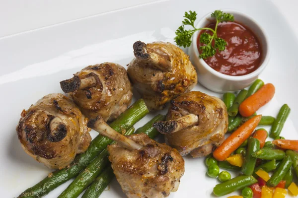 Chicken legs with asparagus — Stock Photo, Image