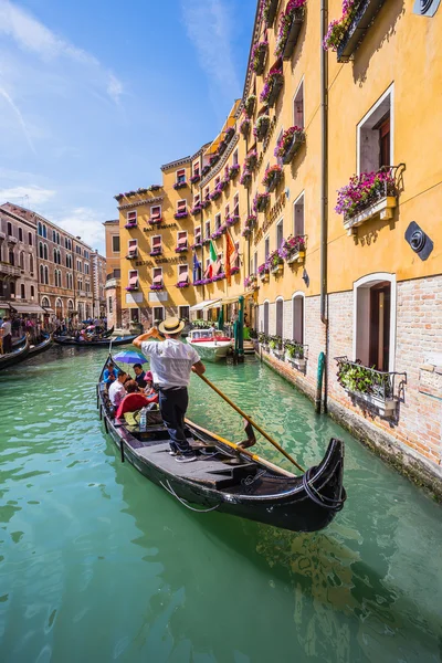 Tourists travel on gondolas at canal — Stock Photo, Image