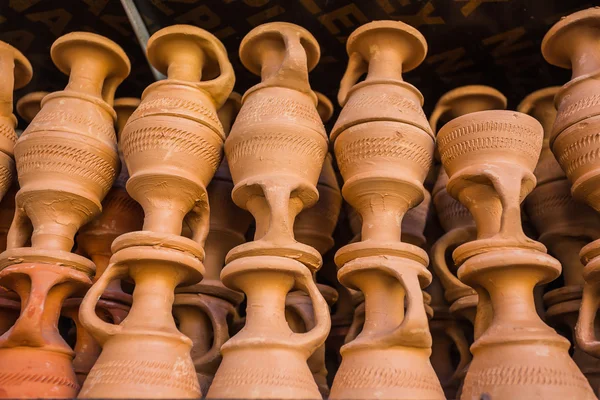 Eastern pitchers stand on a shelf — Stock Photo, Image