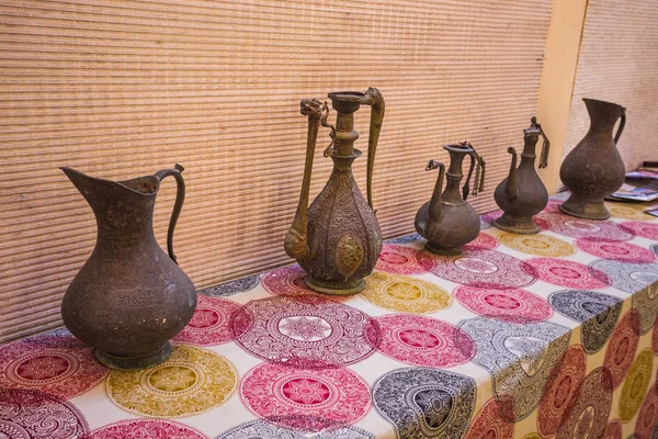 Eastern pitchers stand on a shelf — Stock Photo, Image