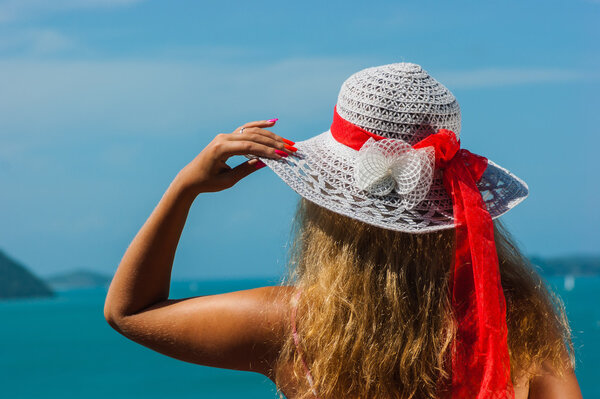 Girl with an umbrella against the sea