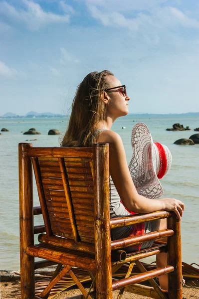 Young girl sitting on chair — Stock Photo, Image