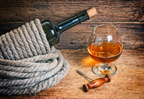 Bottle of wine  with rope Royalty Free Stock Images