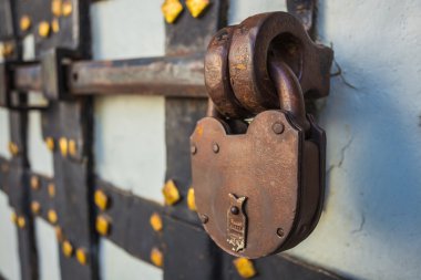 Rusty lock on old door clipart