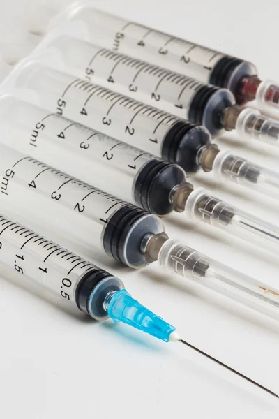 Disposable syringes in row — Stock Photo, Image