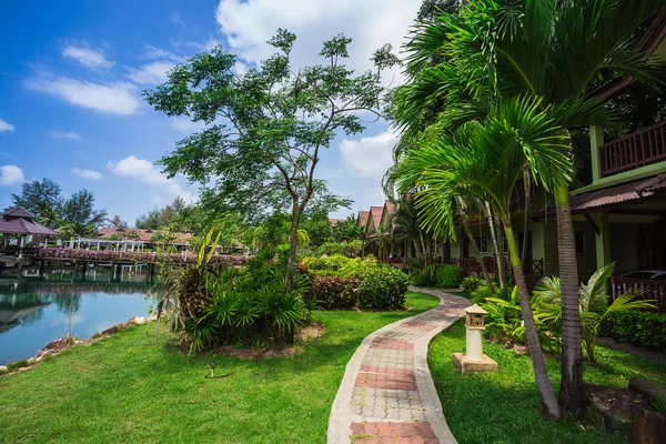 Cottages on the Bay in a tropical garden — Stock Photo, Image