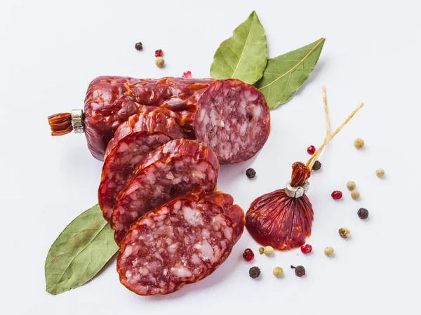 Sliced sausage with spices — Stock Photo, Image