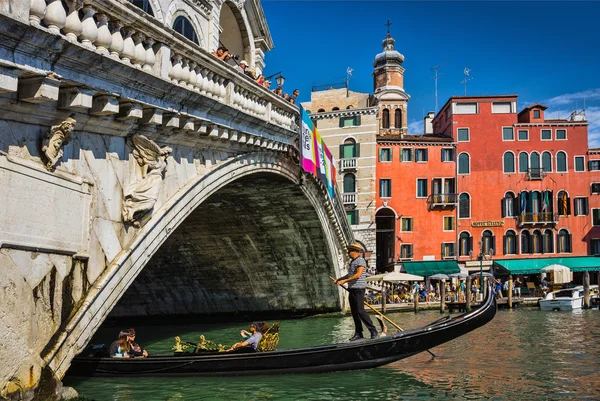 Tourists travel on gondola at canal — Stock Photo, Image