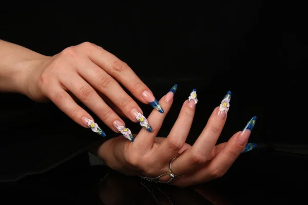 Beautiful hands with french manicure on black background — Stock Photo, Image