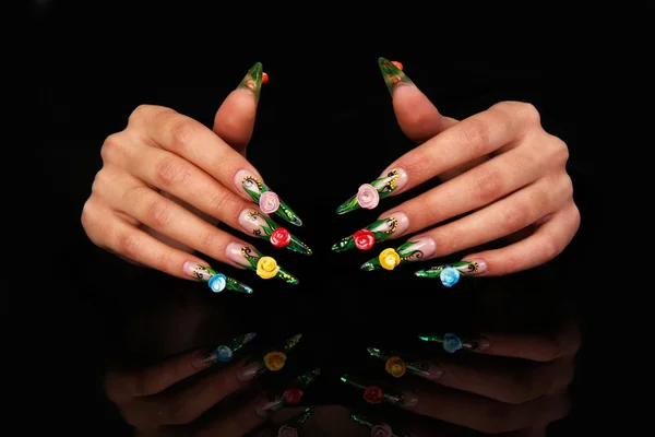 Beautiful hands with french manicure on black background — Stock Photo, Image