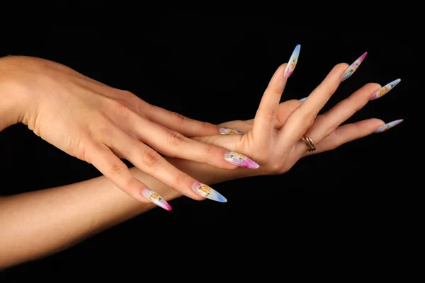 Beautiful hands with french manicure on black background — Stock Photo, Image