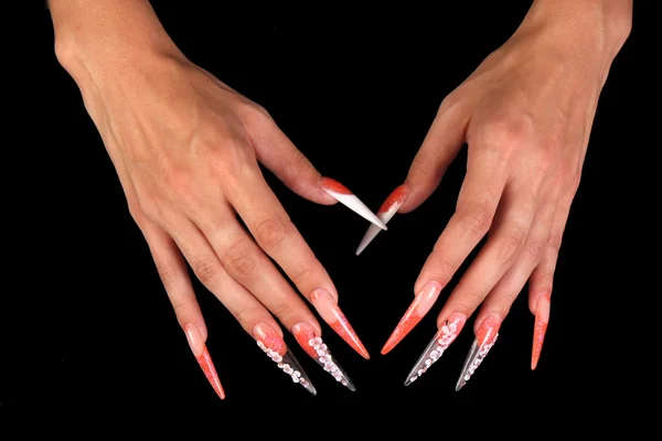 Pretty woman hand with perfect painted nails isolated on black background — Stock Photo, Image