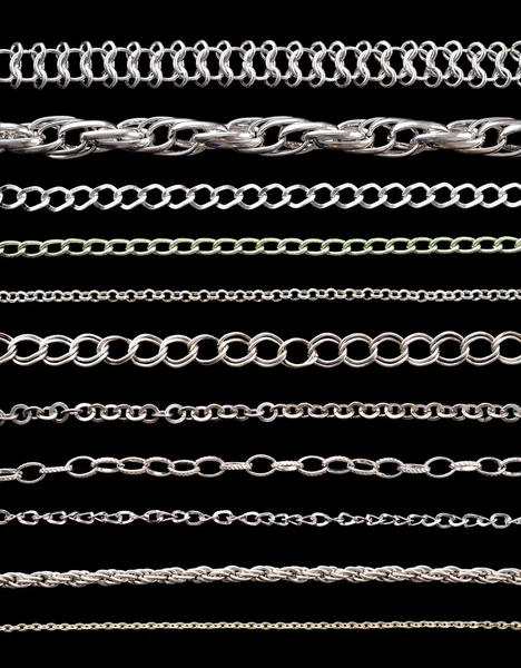 Coleção de correntes em um fundo preto — Fotografia de Stock