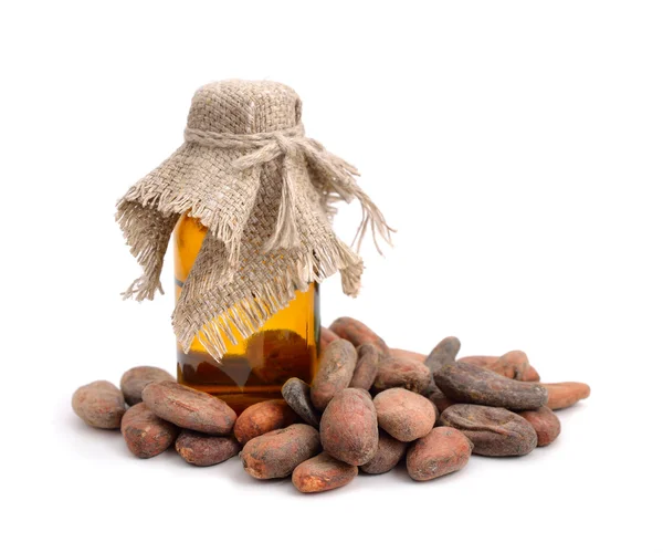 Cocoa beans before roast with pharmaceutical bottle. — Stock Photo, Image