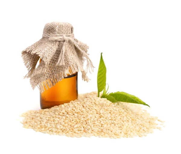 Sesame oil with seeds. — Stock Photo, Image