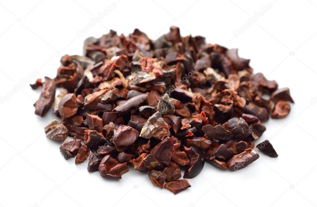 Cocoa nibs. Isolated on white background.