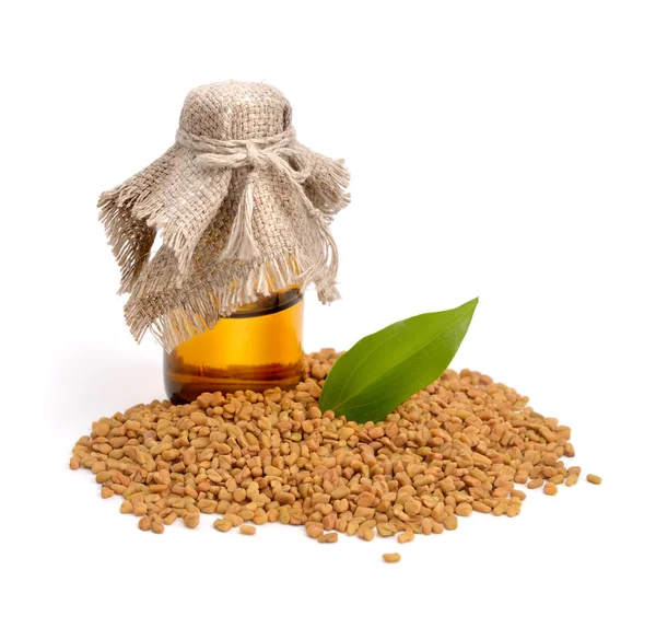 Fenugreek seed with pharmaceutical bottle. (Trigonella foenum-gr — Stock Photo, Image