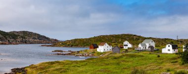 Outport of Hering Neck on New World Island, fishing village of few houses on sheltered Bay off Atlantic Ocean, Newfoundland, NL, Canada clipart