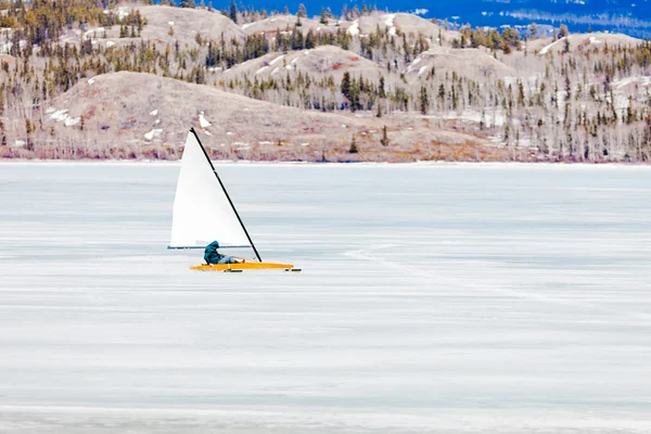 Ice-boat sailing frozen Lake Laberge Yukon Canada — Stock Photo, Image