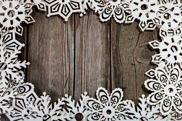 Frame white wooden snowflakes — Stock Photo, Image