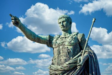 Italy, Rome. Statue in a public street of the roman emperor Gaius Julius Caesar. Concept for authority, domination, leadership and guidance. clipart