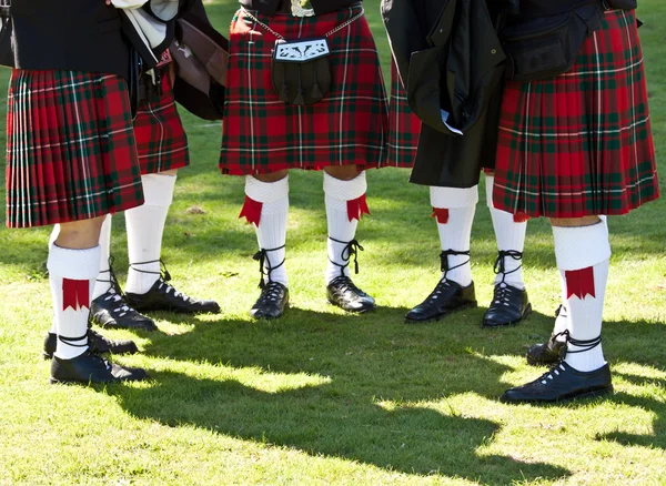 Scottish kilts on green field — Stock Photo, Image