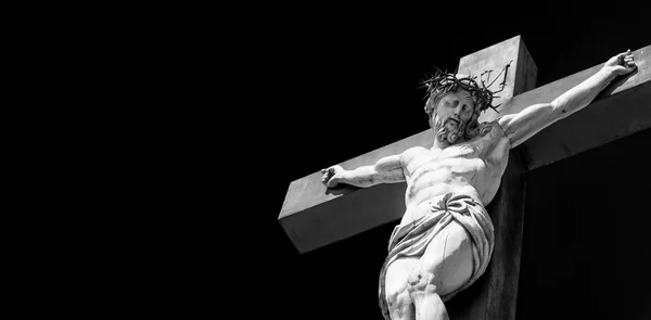 Crucifix made of marble with blue sky in background. France, Provence Region — Stock Photo, Image