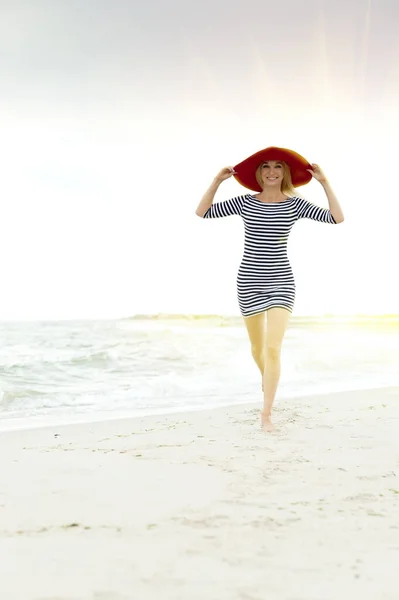 Beautiful Sexy Blonde Girl Striped Dress Red Hat Runs Beach — Stock Photo, Image