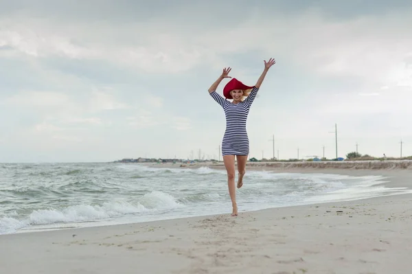 Beautiful Sexy Blonde Girl Striped Dress Red Hat Runs Beach — Stock Photo, Image