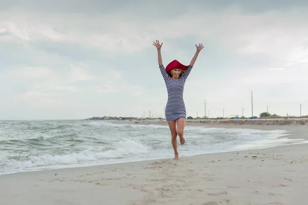 Beautiful Sexy Blonde Girl Striped Dress Red Hat Runs Beach — Stock Photo, Image