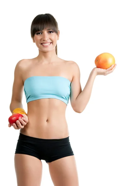 Fitness girl in sportswear with fruits — Stock Photo, Image