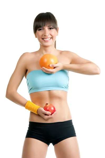 Fitness girl in sportswear with fruits — Stock Photo, Image