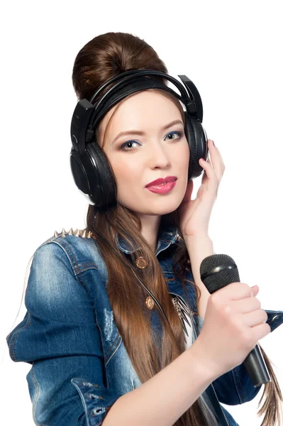 Beautiful girl with a microphone and headphones — Stock Photo, Image