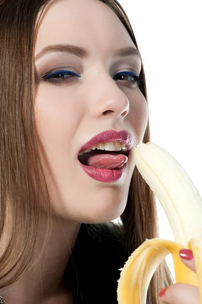 Menina comendo uma banana — Fotografia de Stock