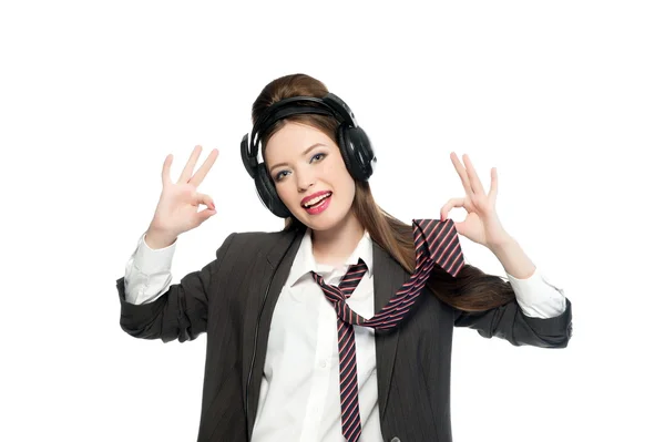 Girl in  jacket and tie in headphones — Stock Photo, Image