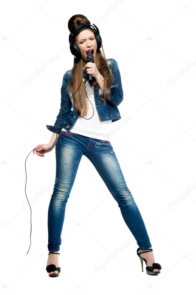 Beautiful girl with a microphone and headphones